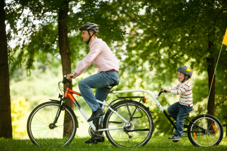 Single Parent and Son Riding Bikes Single Parent and Son Riding Bikes